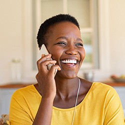 Woman smiling while talking on phone