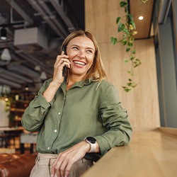 Woman smiling while talking on cellphone