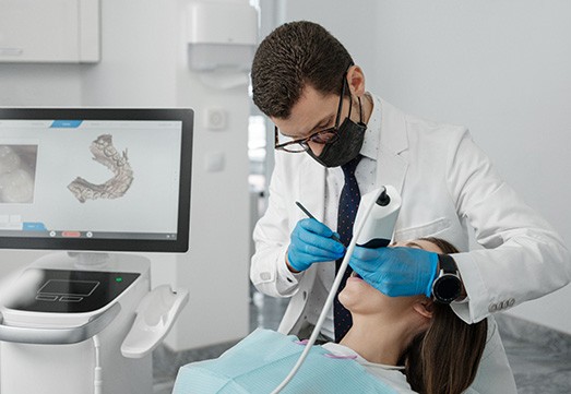 an orthodontist examining a patient’s mouth