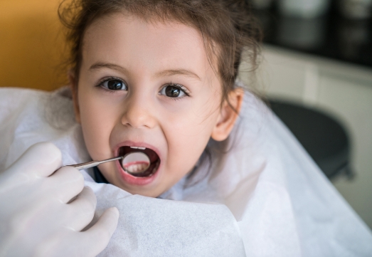 Child receiving regular dental checkup to prevent dental emergencies