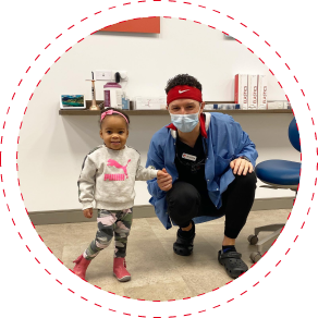 Dentist and infant patient in pediatric dental office