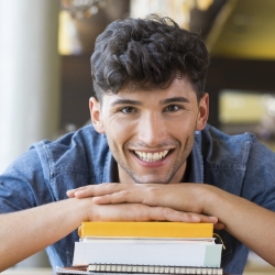 Teen man smiling after visiting the orthodontic office