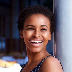 Woman with healthy smile after visiting the dentist