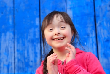 Young girl smiling after special needs dental visit