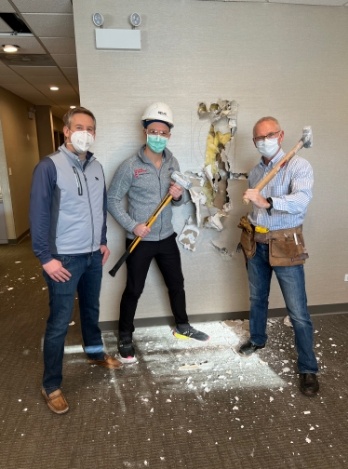 3 men working on construction