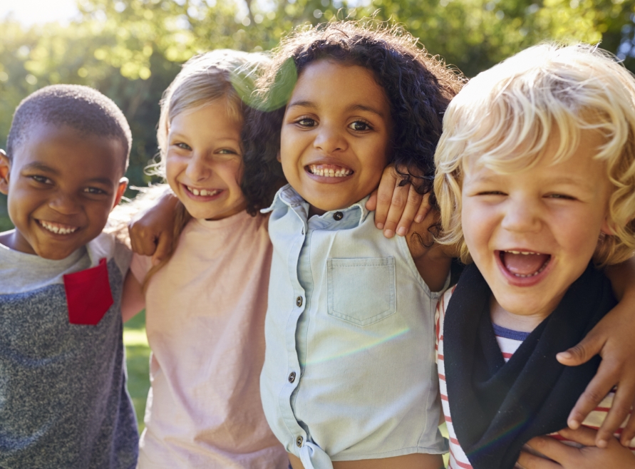 Group of kids with healthy smiles thanks to preventive dentistry