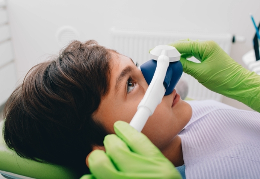 Child receiving nitrous oxide dental sedation