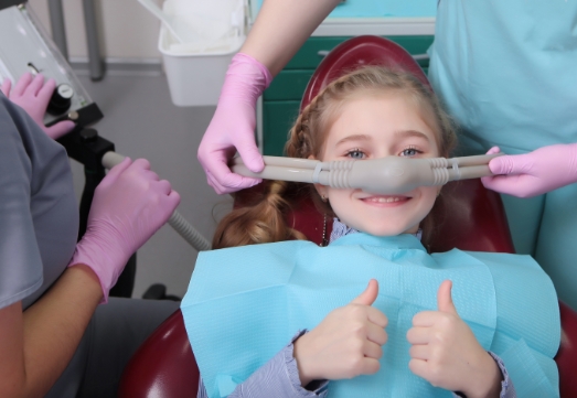 Child receiving sedation dentistry during special needs dental visit