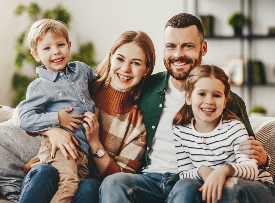 Family with young children smiling