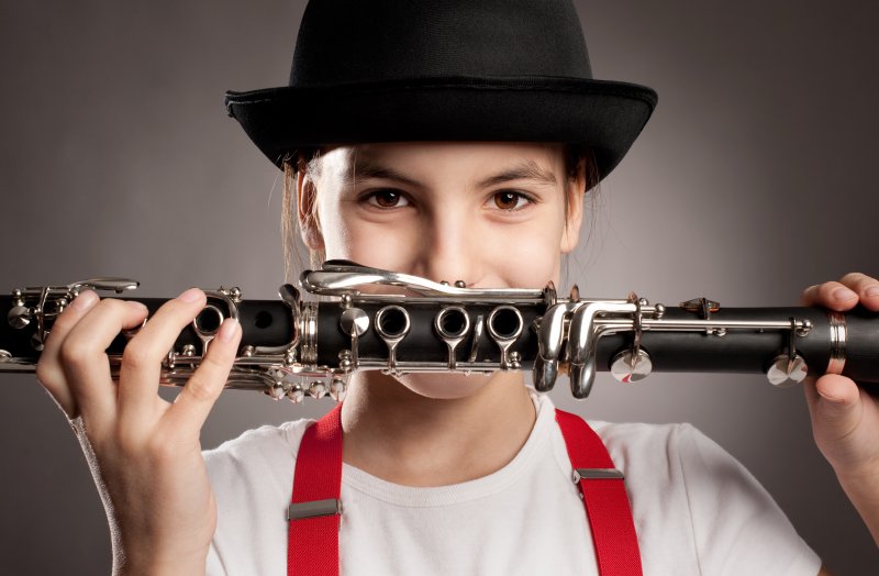 young person holding an instrument