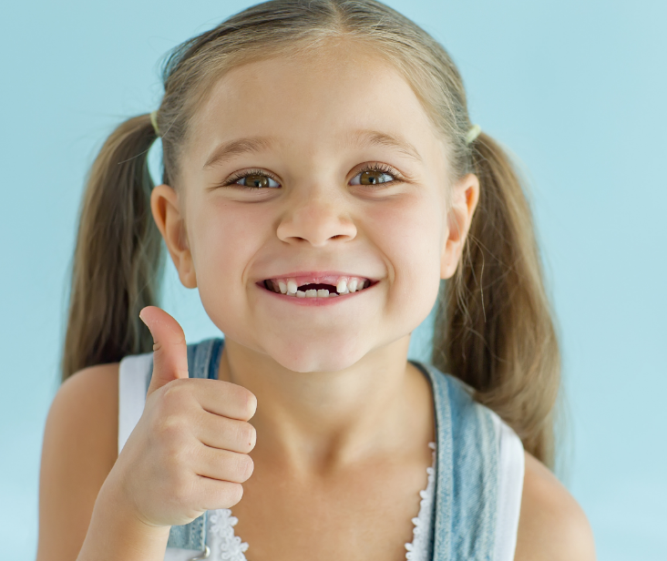 Girl with missing front teeth